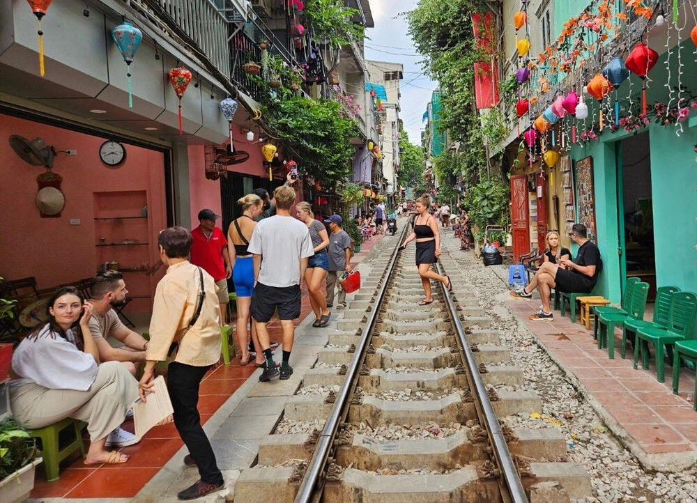 Capture the thrilling rush of Hanoi’s iconic Train Streets